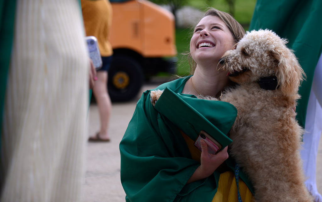 Rock Bridge High School graduate Jadyn Lisenby smiles at her friends